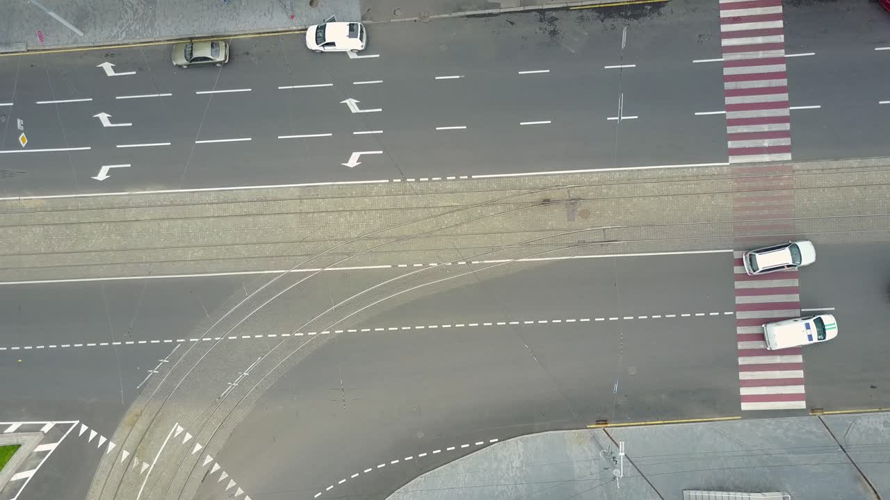 Traffic Jam And Urban Transport. Crossroads in the city, cars drive through part of the road, aerial view