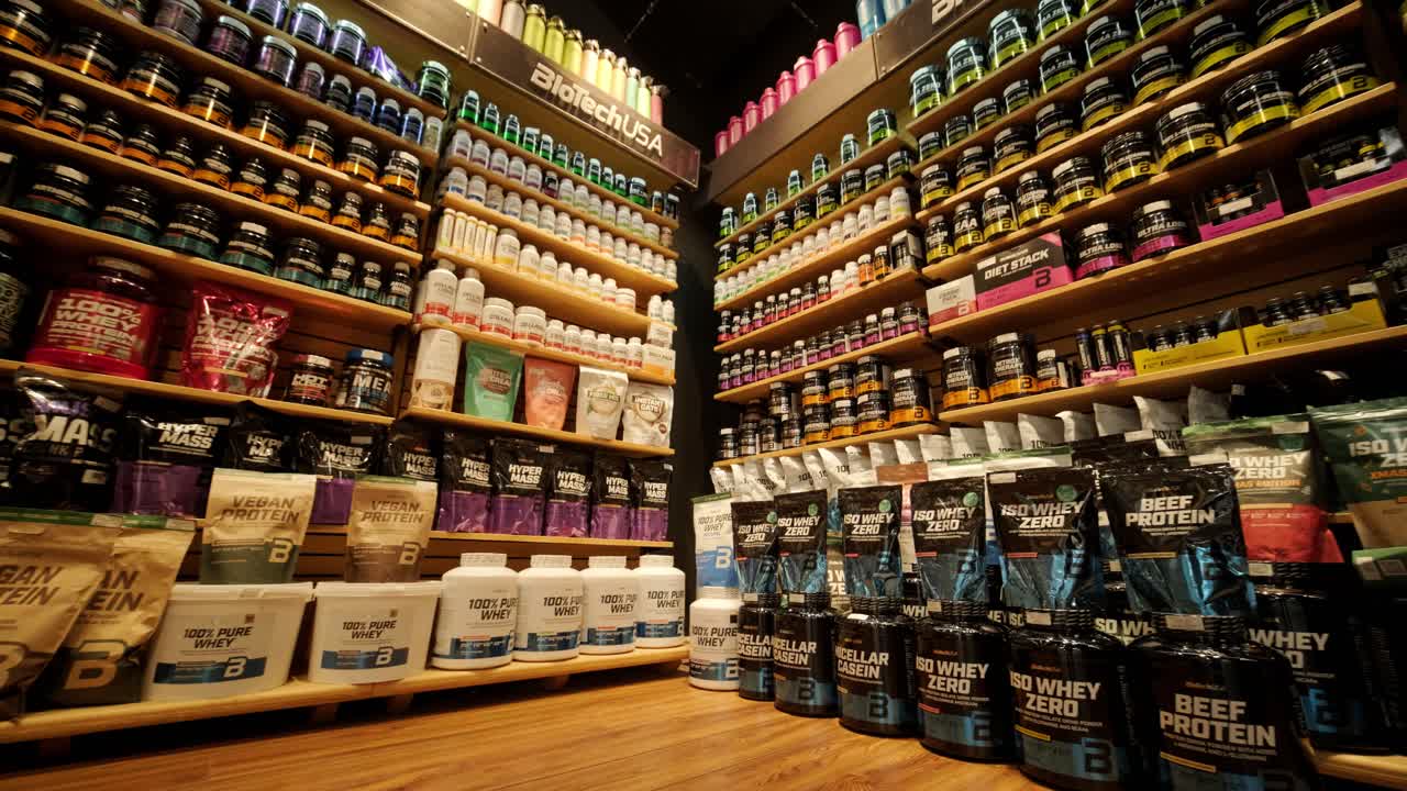 Sport nutrition store interior with large choice of nutritional supplements.
