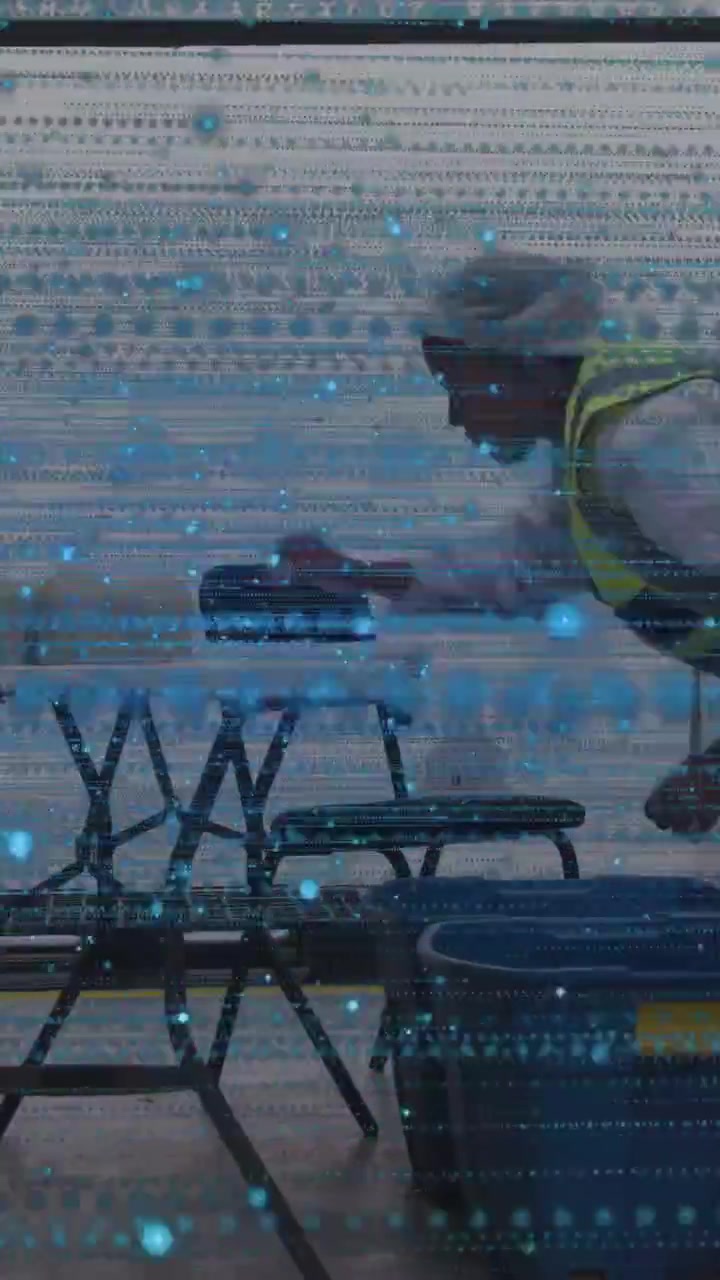 Vertical video: Woman opening blue bin placing on tables for event scanlines crossing around her