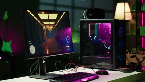 Shooter-game-on-computer-desktop-display-in-RGB-lit-home