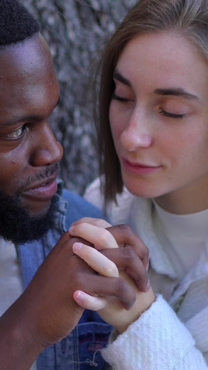 Affectionate Interracial Couple Holding Hands