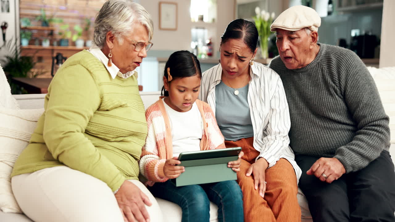 Multi-generational family using a tablet together at home