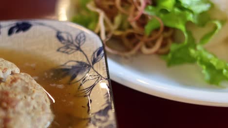 assembling and serving traditional bun cha dish