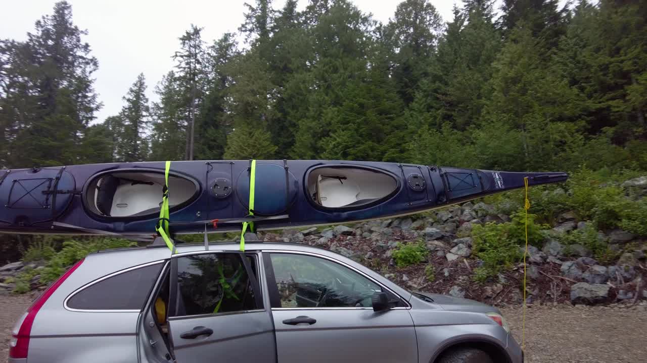Kayak on a car's roof rack ready for an adventure