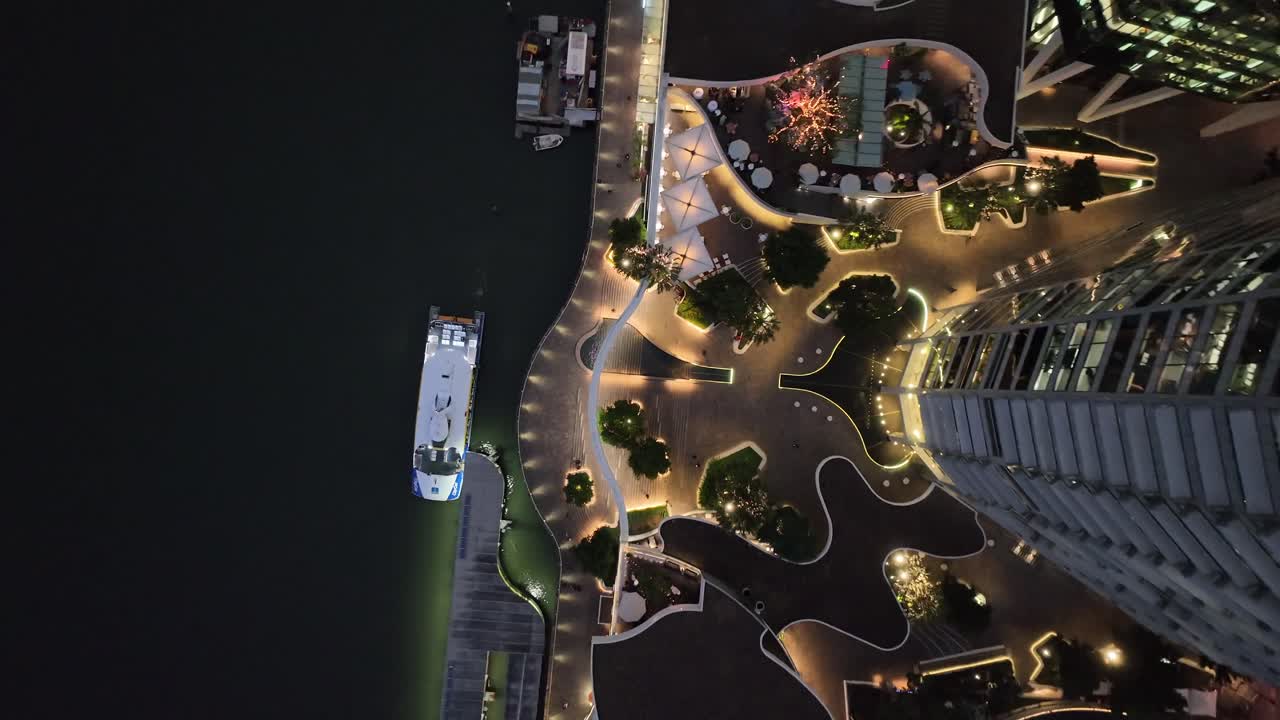Topdown aerial shot of Brisbane City's Eagle Street Pier boardwalk at night time