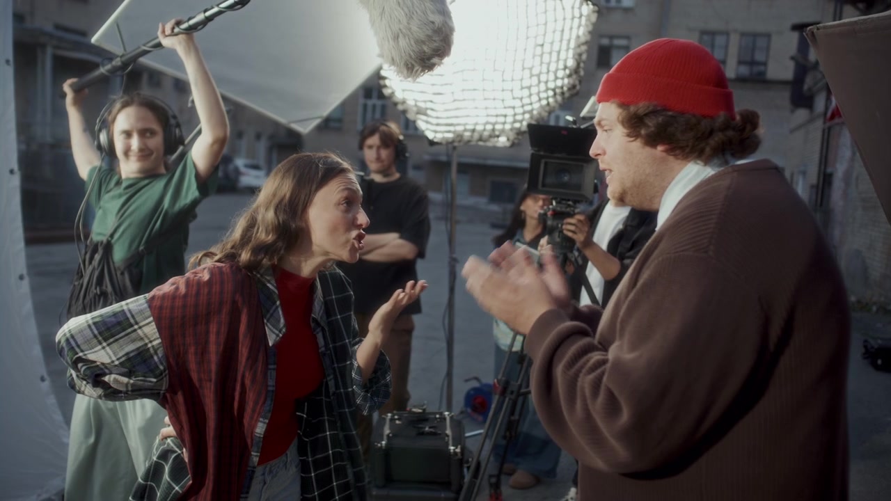 Actors Performing Emotional Argument Scene during Shoot with Film Crew