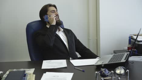 businessman talking on phone in office