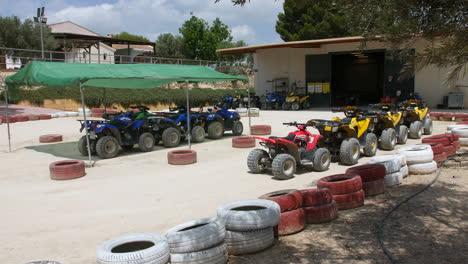 quad bikes at a quad bike rental station at a race track trail