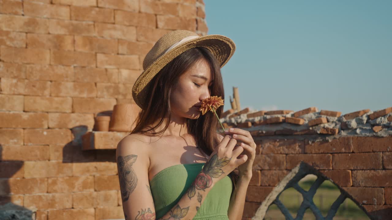 Woman with a flower in a garden