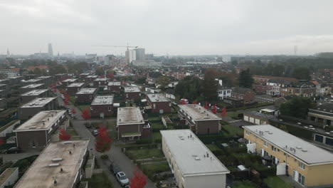 Identical-apartment-buildings-in-Belgium-on-foggy-day,-aerial-view