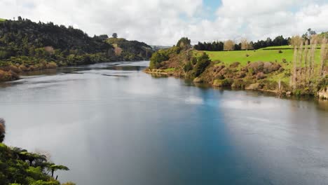 drone pull-back shot of a lake in new zealand