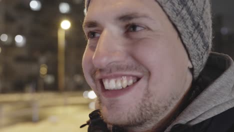 happy positive young male with wide smile in closeup mumbling something