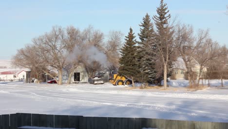 Big-machine-plowing-the-snow-in-the-street-during-the-winter-time-in-Canada