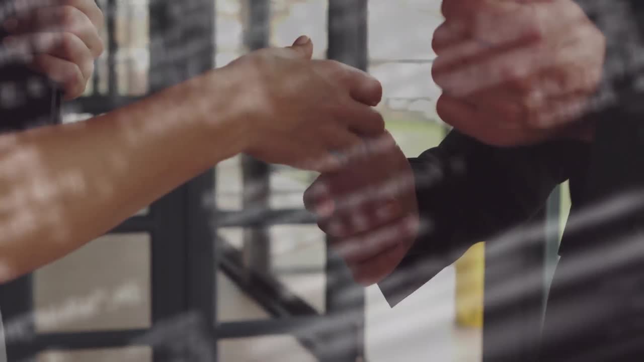 Animation of data processing over businessman handshake