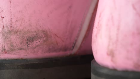 close-up of worn pink boots