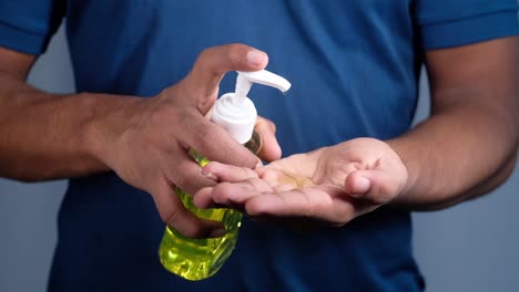 applying hand sanitizer