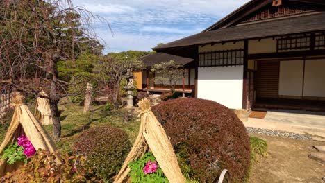 a serene view of a japanese house with garden