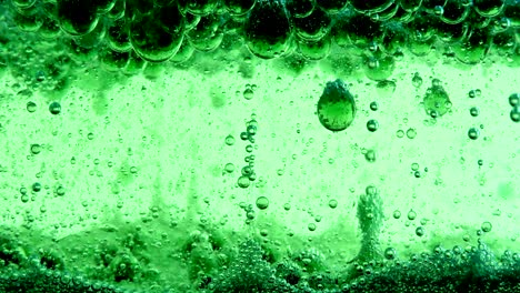 water oil bubbles  behind glass background