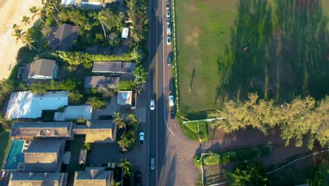 Aerial-topdown-view-of-Ohau-Coastline,-Scenic-road-by-PapaIloa-Beach,-Tilt-up-shot