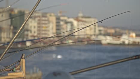 Fishermen-fishing-on-the-Bosphorus,-Galata-Bridge,-with-a-sea-view