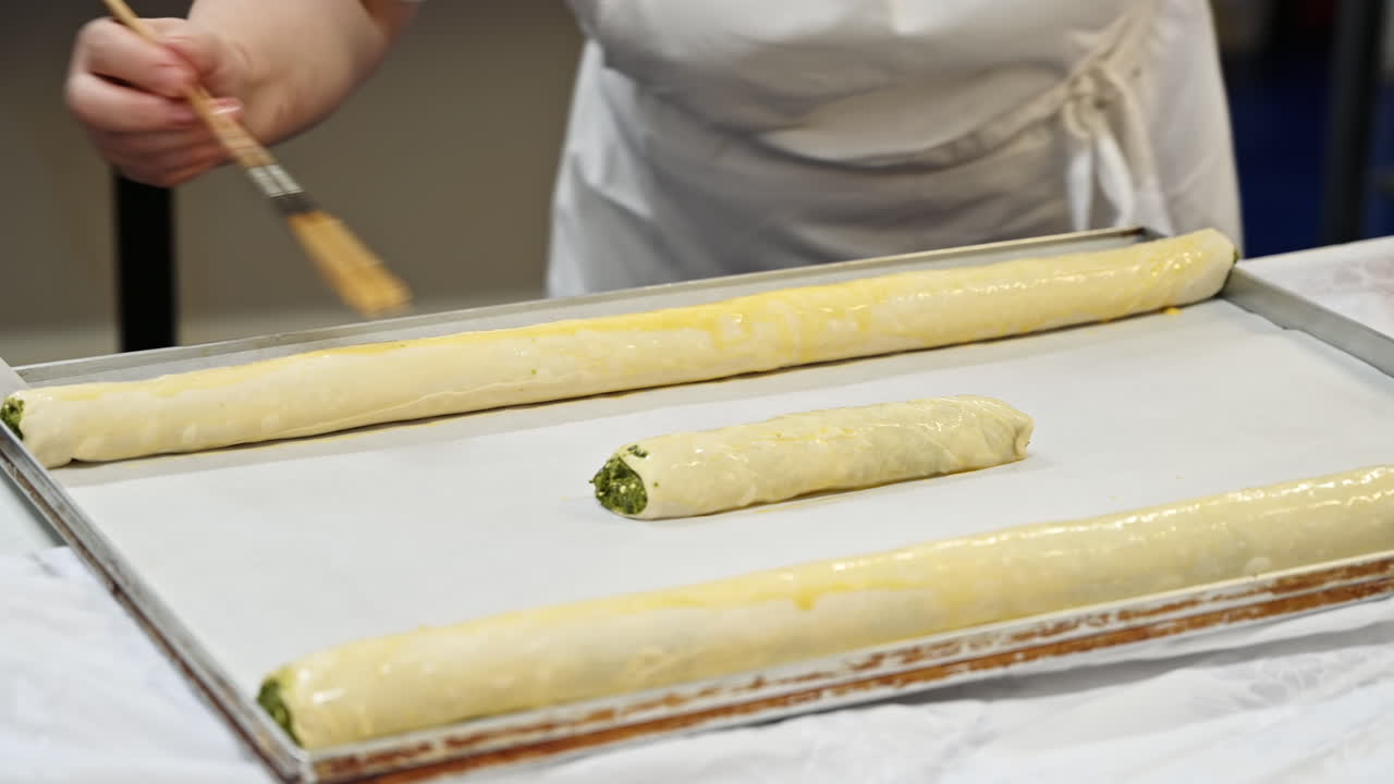 Cook lubricates raw placints with oil, Romanian and Moldovan traditional food