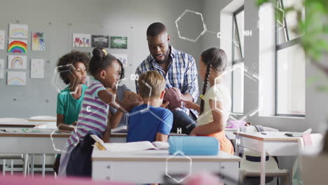 animation of chemical formula over diverse schoolchildren learning with male teacher in classroom