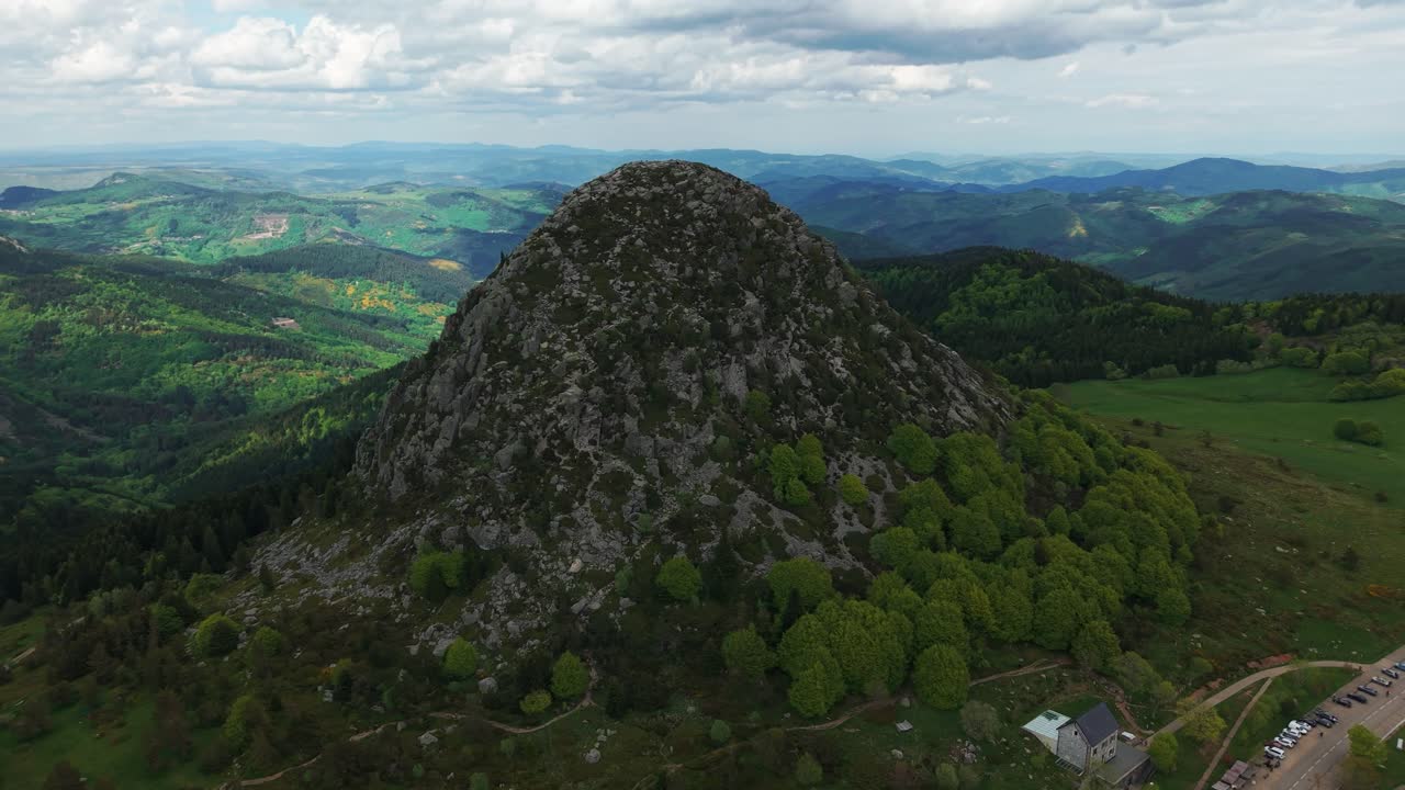 aerial shot above the Mont Gerbier de Jonc, source of the Loire River in Ardeche on a cloudy day, Auvergne Rhone Alpes region, France