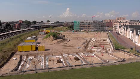 low aerial approach showing noorderhaven neighbourhood and ubuntuplein construction site in urban development real estate investment project