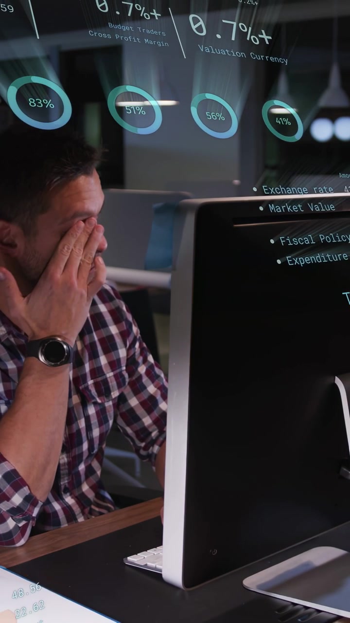 Vertical video: Male analyst noticing HUD finance graphs updating and typing, analyzing trades