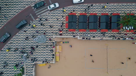 aerial evening seaside promenade with holidaymakers enjoying weekend leisure.