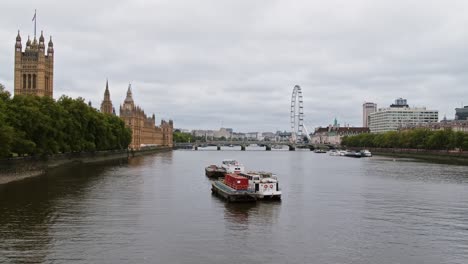view from lambeth bridge over the river thames in london with westminster parliament, westminster bridge and london eye in the background.