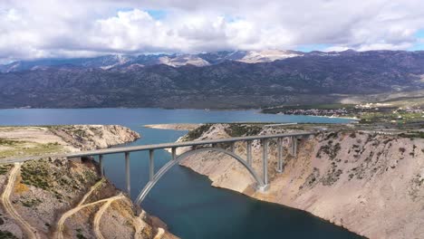 aerial view on the beautiful maslenica bridge on a cloudy day in croatia - drone shot