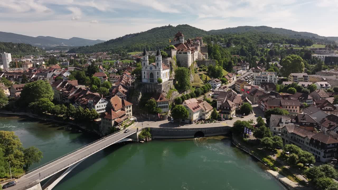 aerial of aarburg castle and river aare with rooftops and hills in switzerland