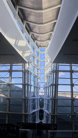 vertical view, interior of houston intercontinental airport, arrival gate, escalator view