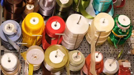 colorful sewing threads background many spools of thread of different colors colorful sewing threads background many spools of thread of different colors sewing tools hobbies and handicrafts