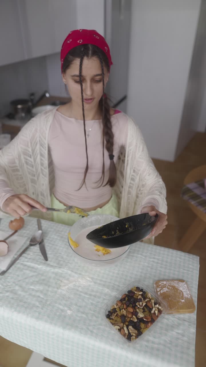 Teenager baking in a kitchen