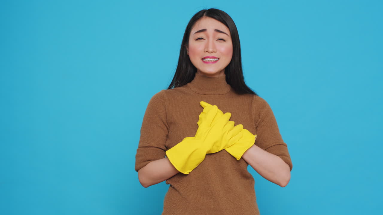 Happy professional maid being happy about finishing home cleaning