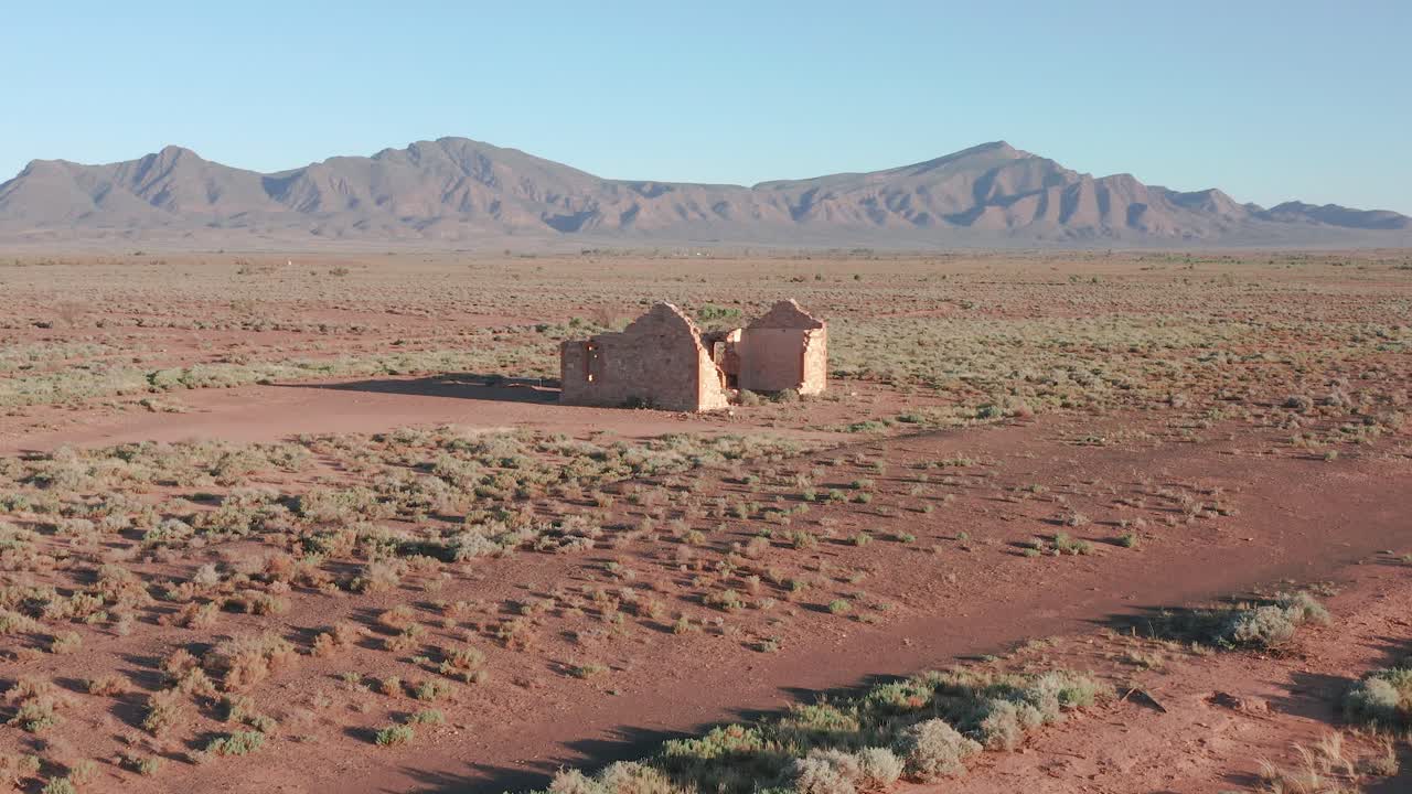 Old settler ruins with Flinders Ranges mountains in background, South Australia