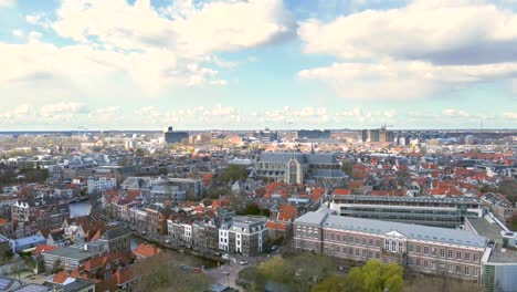 Aerial-shot-of-the-historical-city-centre-of-Leiden,-the-Netherlands,-on-a-beautiful-summer-day