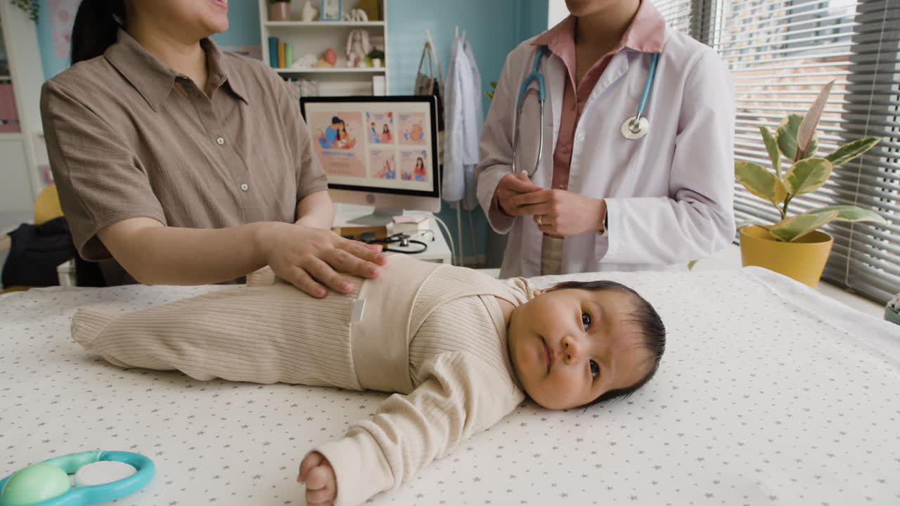 Baby Exam with Doctor and Mother