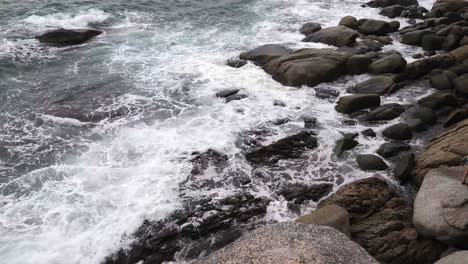 ocean waves crashing against rocky coast