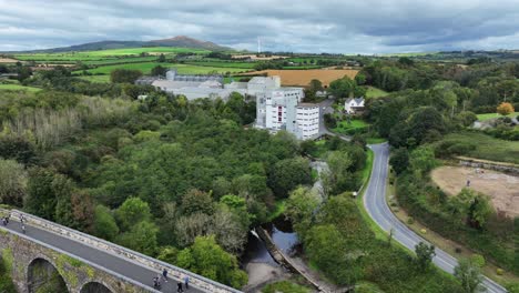 ireland epic locations drone landscape flying over kilmacthomas viaduct with people walking to mill waterford greenway ireland