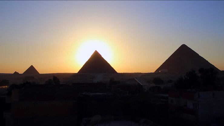 Sunrise behind the great pyramids of Giza 2