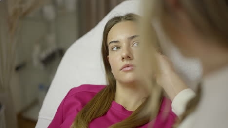 woman receiving a beauty or skincare treatment