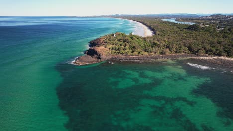headland and lighthouse at fingal head in nsw, australia - aerial drone shot