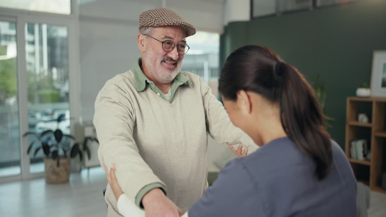 Caregiver assisting senior man