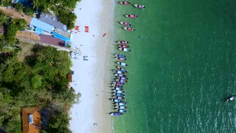 Aerial-dolly-zoom-of-docked-long-tail-boats-at-Railay-Beach,-Ao-Nang,-Krabi,-Thailand