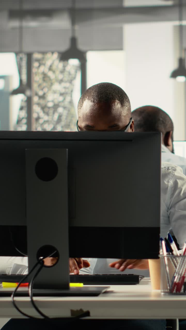 Vertical Video Staff in office discuss business strategy and market research