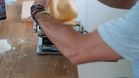 4K-Slow-Motion:-Italian-Chef-Creates-Tagliatelle-Pasta-using-Imperia-Machine---Closeup-Shot