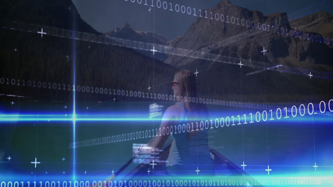 Female paddler paddling canoe Alpine lake at dawn activating binary overlays showing data insights